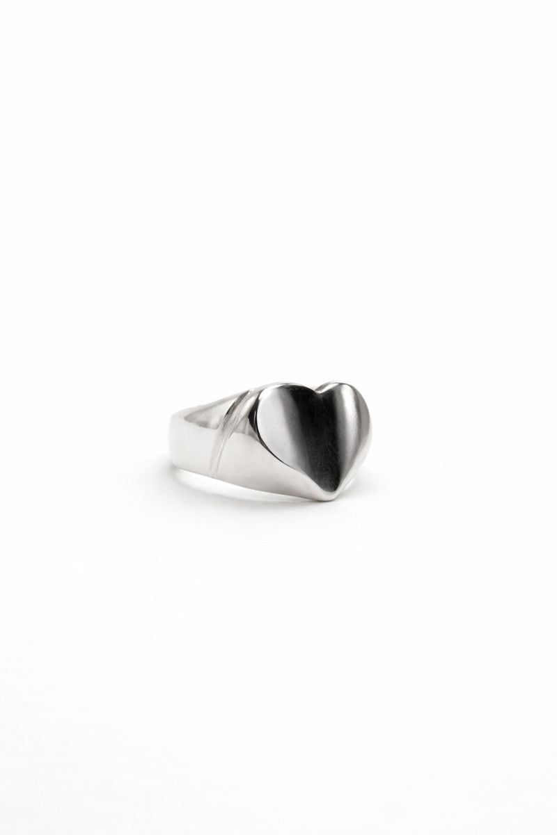 Silver heart-shaped ring on a white background