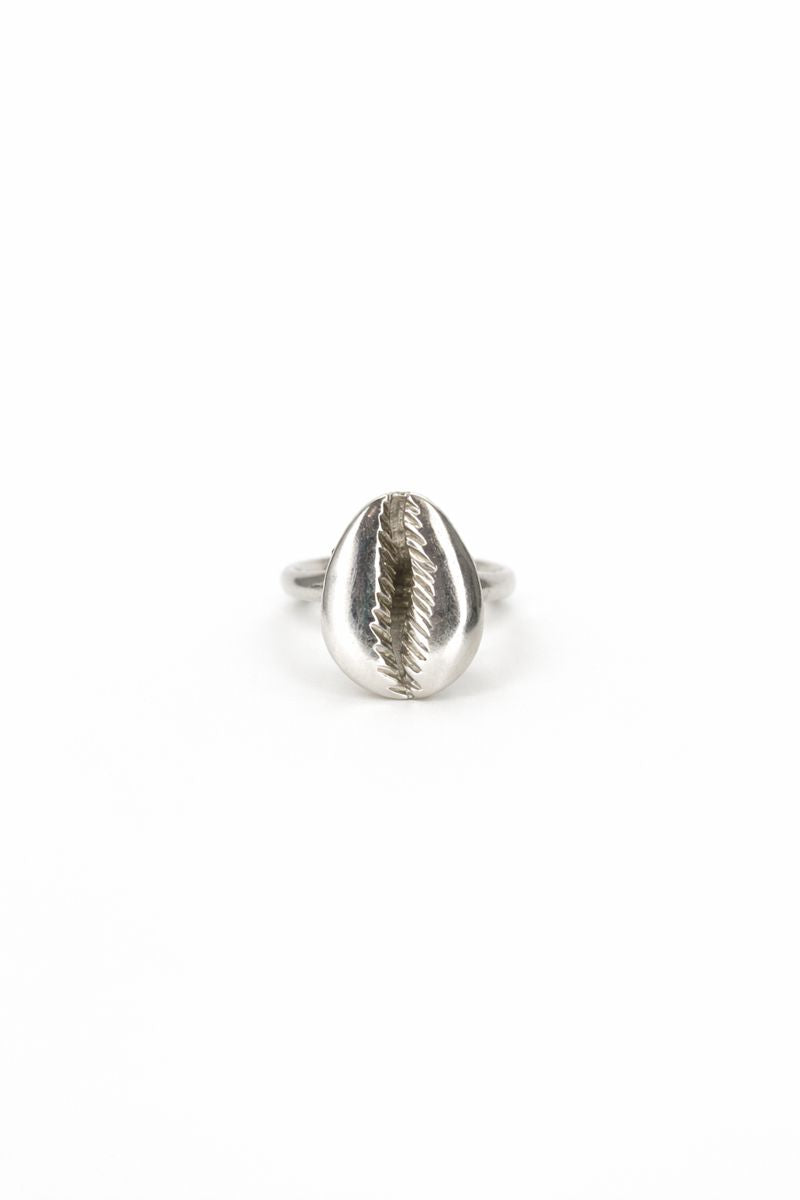 Silver ring with a cowrie-shaped design on a white background