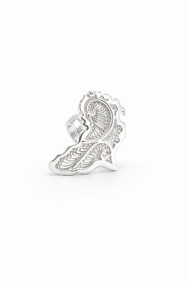 africa Silver ring with intricate design on a white background