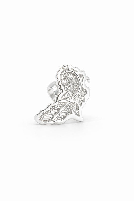 africa Silver ring with intricate design on a white background
