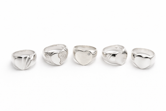 Sterling silver heart ring collection featuring polished, textured, and stone-set designs