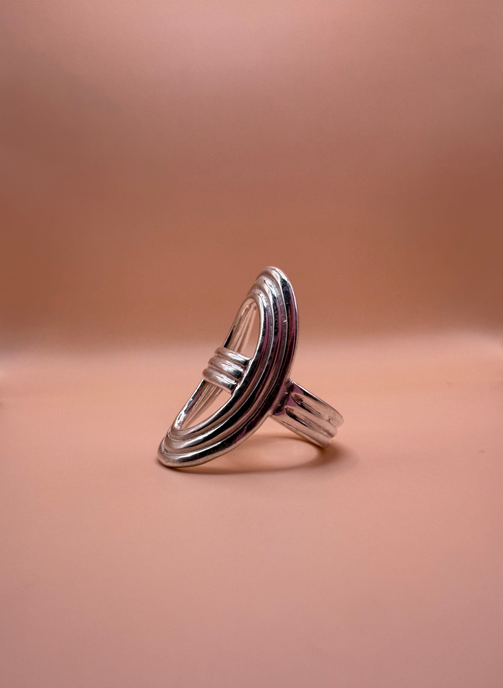 shield ring on pink background